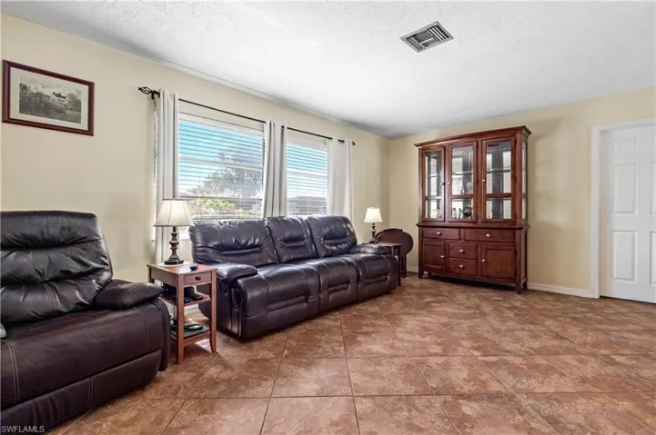 Living area featuring a textured ceiling