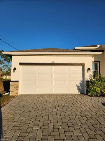 Garage featuring driveway