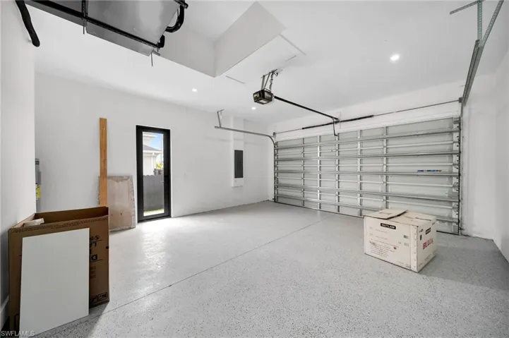 Garage featuring a garage door opener