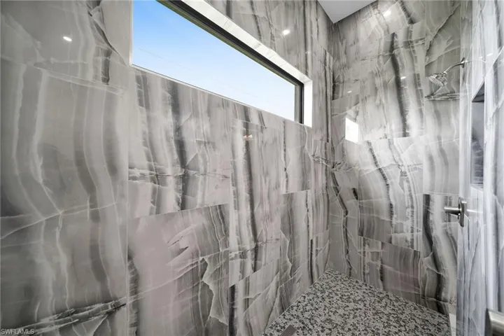 Bathroom with a tile shower