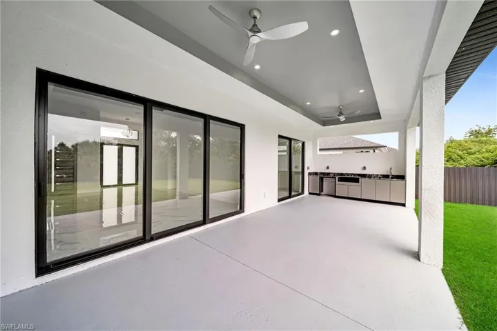 View of patio featuring ceiling fan