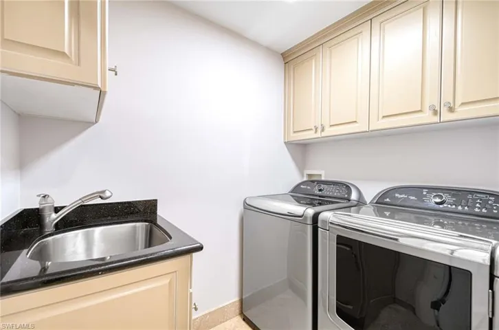 Laundry area with washing machine and dryer and cabinet space