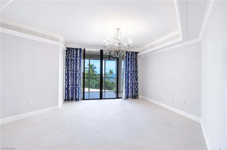 large master bedroom over looking the screened Lanai area with view of the Gulf of America