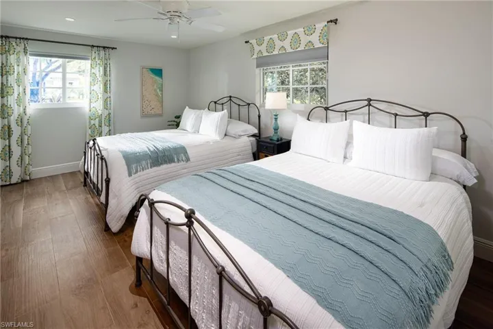 Bedroom featuring wood finished floors and a ceiling fan