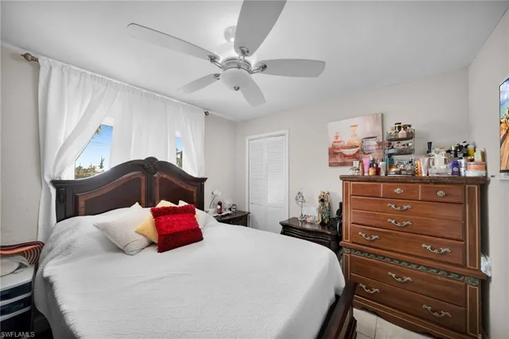 Bedroom featuring a closet and ceiling fan