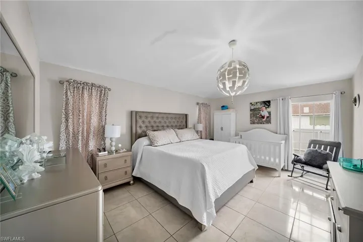 Bedroom featuring light tile patterned flooring