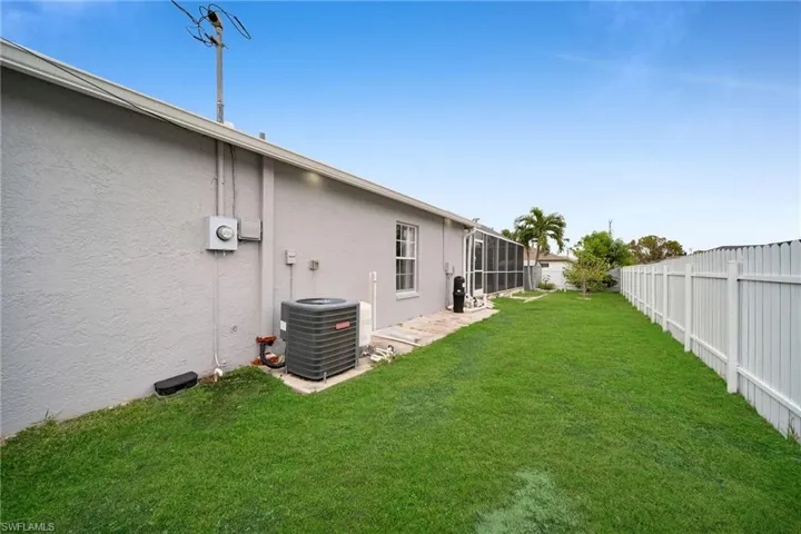 View of yard with central AC unit