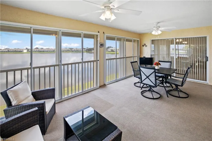 Impressive, 20ft, 4 season, screened lanai with roll down shutters and peaceful view of Lake Rio
