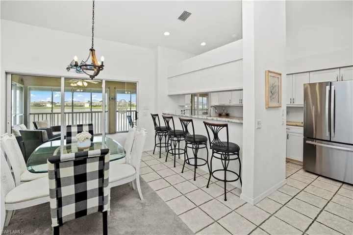 dining area, breakfast bar and upgraded kitchen