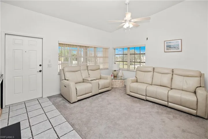 spacious living room with lots of windows and great views