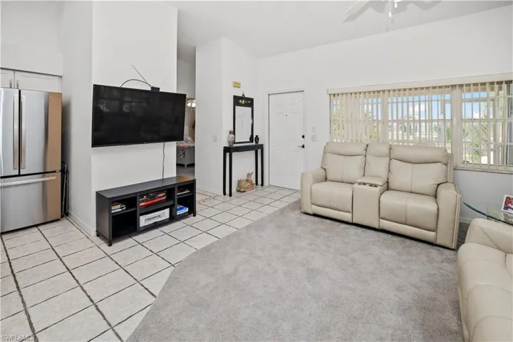 spacious living room with lots of windows and great views
