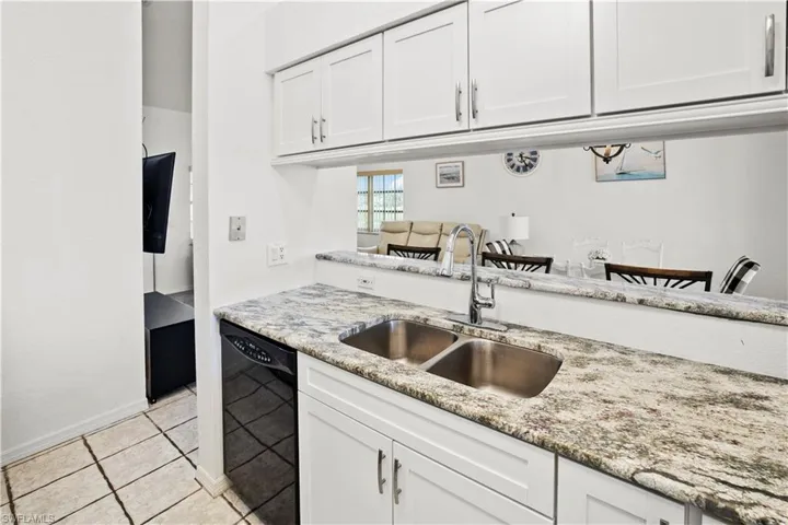 kitchen with breakfast bar to dining area