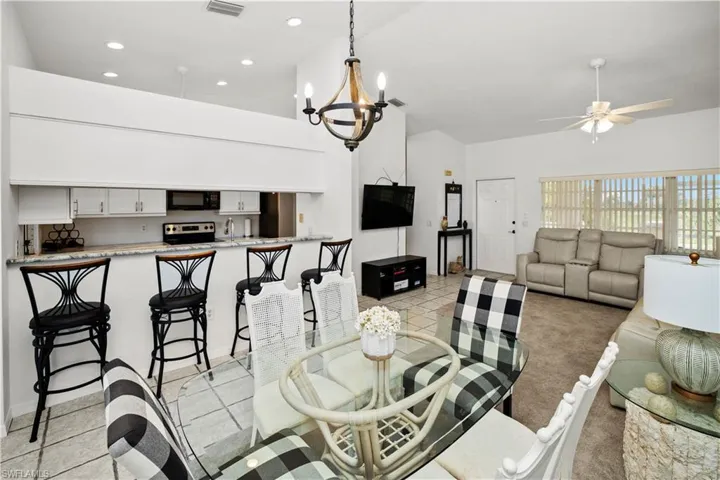 open floor plan with living, dining and kitchen all with great views