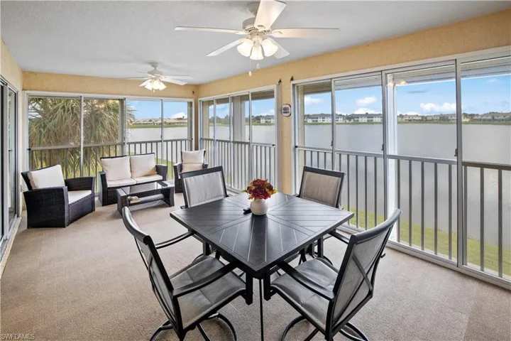 Impressive, 20ft, 4 season, screened lanai with roll down shutters and peaceful view of Lake Rio
