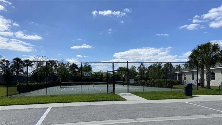 View of sport court with tennis court and basketball area