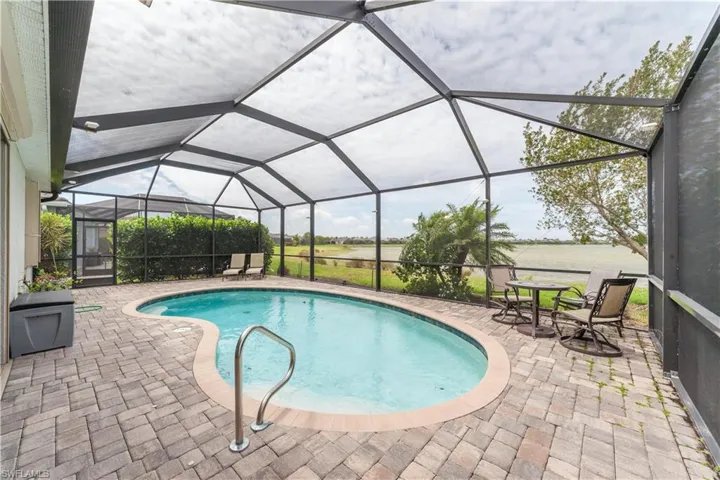 Pool featuring a lanai and a patio
