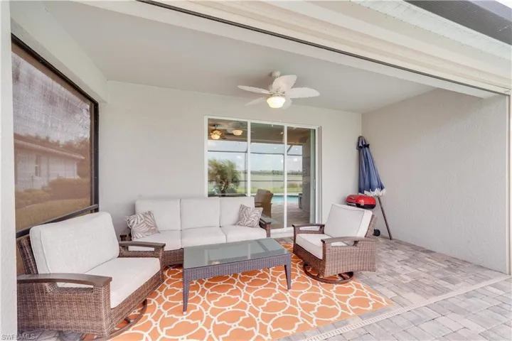 Covered patio featuring great outdoor seating a ceiling fan