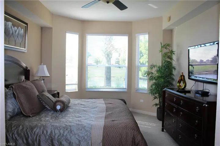 Master Bedroom with carpet flooring and ceiling fan