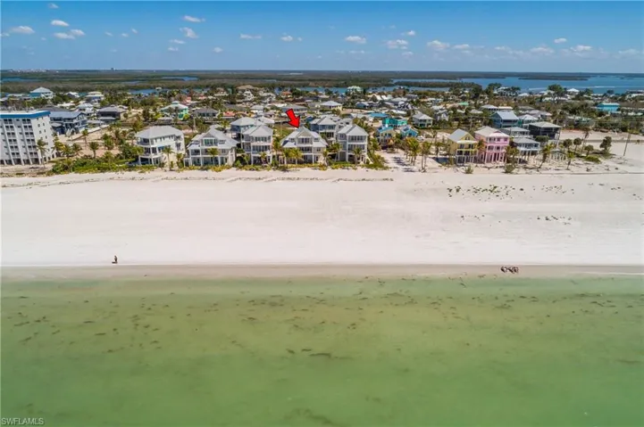 Aerial view of residential area with expansive beach