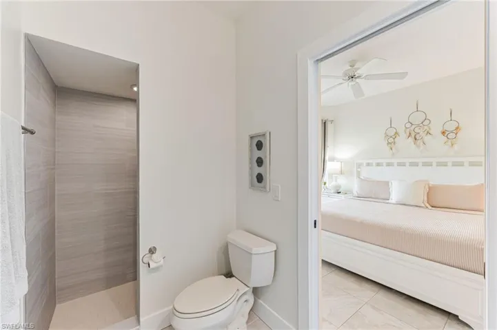 Bedroom with multiple windows, a ceiling fan, and recessed lighting