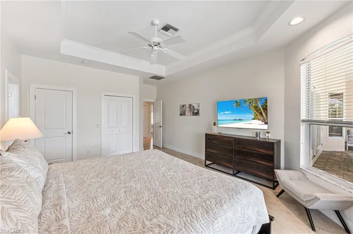 Full bath featuring double vanity, tile patterned flooring, and tiled shower