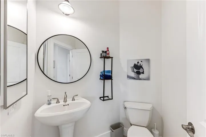 Bedroom with ornamental molding, a raised ceiling, a ceiling fan, and recessed lighting