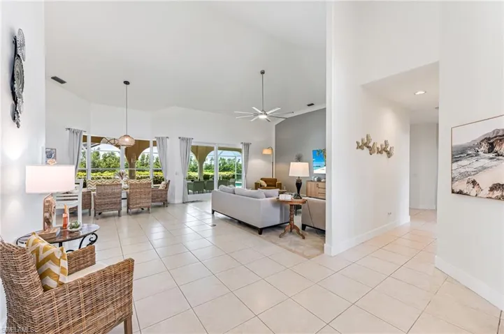 Foyer entrance featuring a high ceiling and light tile patterned flooring