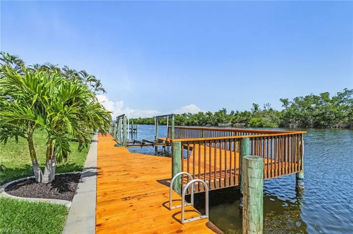 Dock with boat lift and a water view