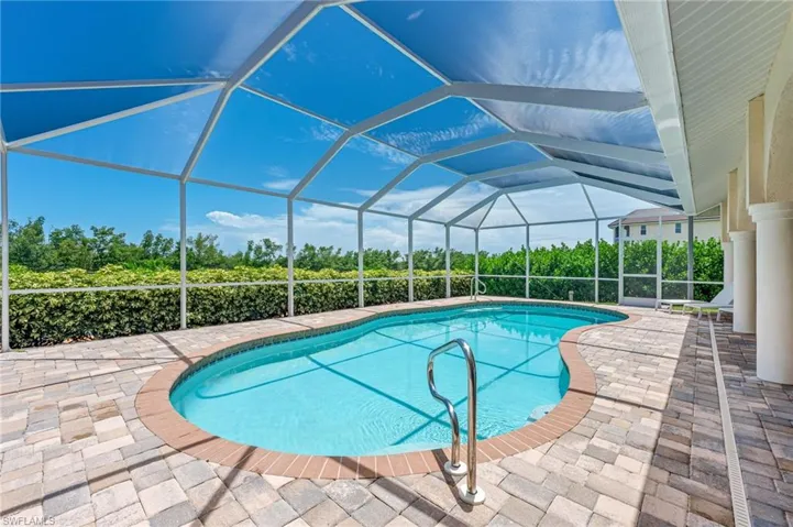 View of exterior entry featuring stucco siding and a tiled roof