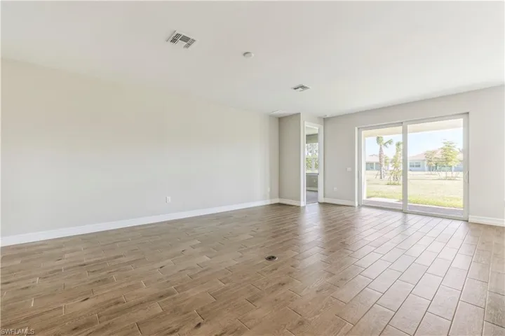 Spare room featuring light hardwood / wood-style flooring