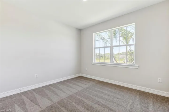 Spare room with carpet flooring