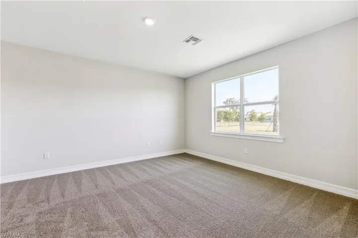 View of carpeted spare room