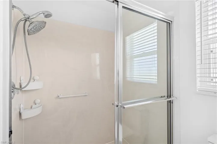 Full bath with a shower with shower door