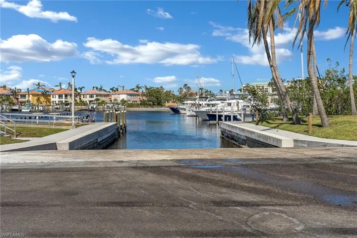 View of dock with a water view and a residential view