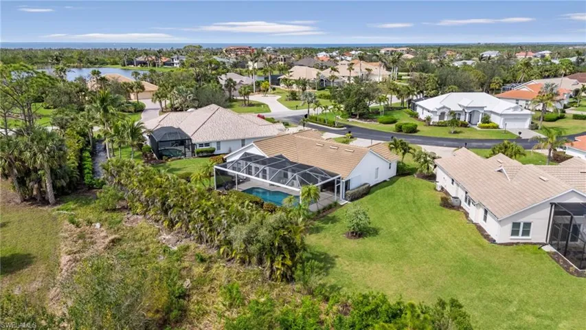 Aerial view featuring a water view and a residential view