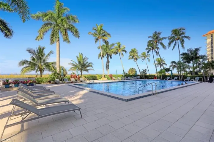 Community pool featuring a patio