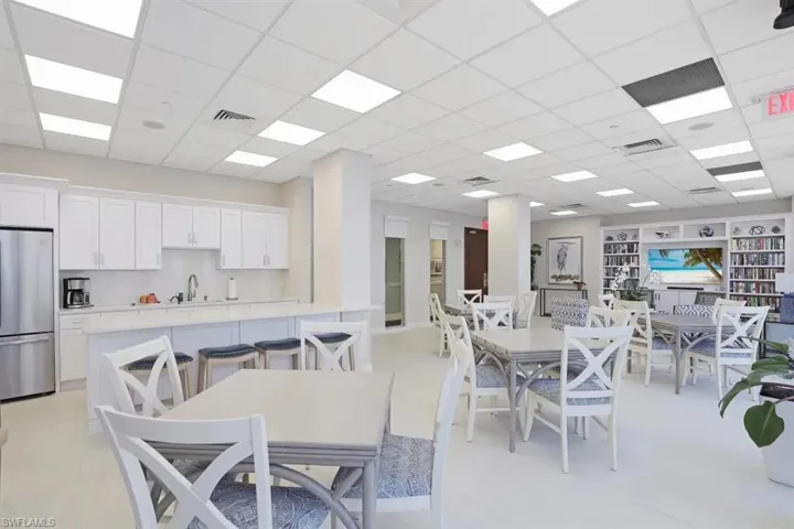 Dining area featuring visible vents and a drop ceiling