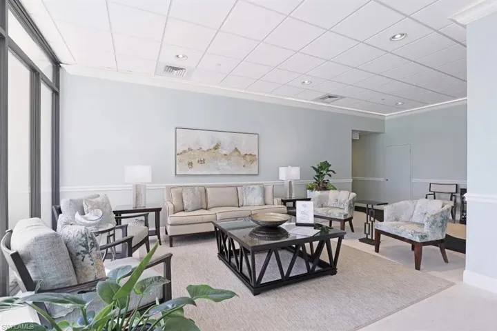 Living area featuring visible vents and recessed lighting