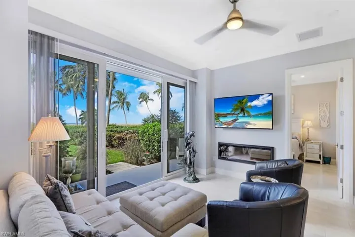 Living area with visible vents and ceiling fan