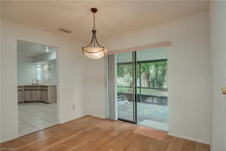 Unfurnished dining area with healthy amount of natural light and light wood finished floors