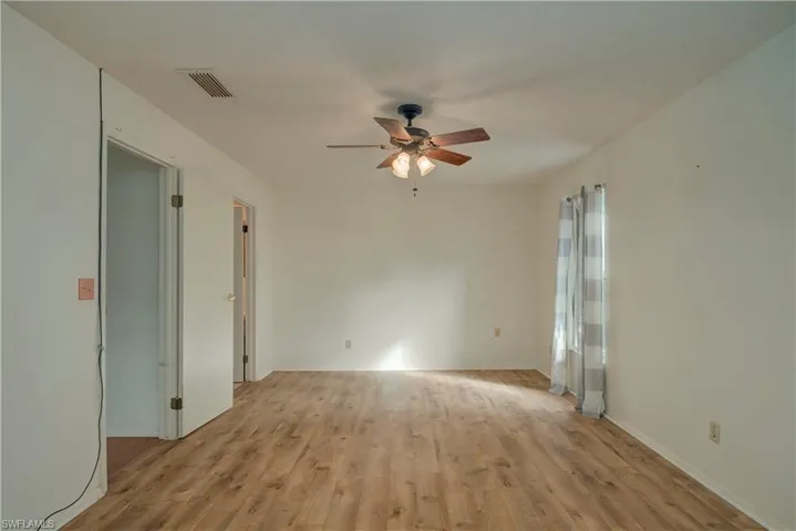 Master bedroom showing exit to living room and entrance to master bath.