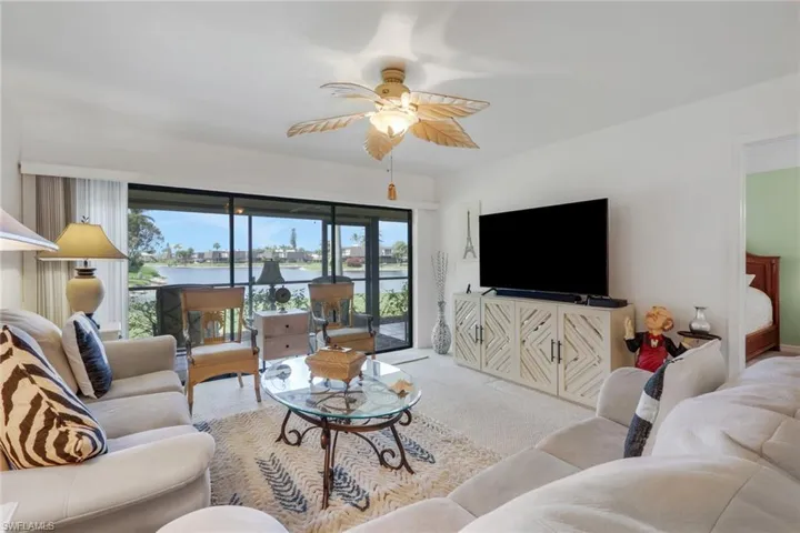 Lanai with Storm-Smart impact blinds and a water view