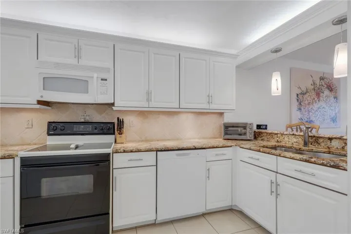 Kitchen featuring with custom drawers and pullouts