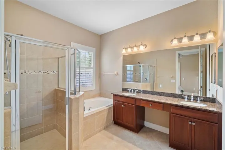 Primary Bathroom with two sinks, large shower and soaking tub