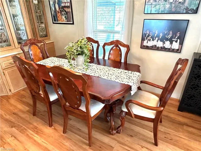 Dining space with light hardwood / wood-style floors