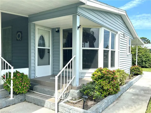 Property entrance with covered porch