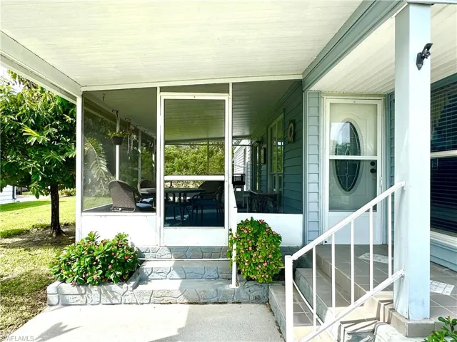 View of exterior entry with a lanai