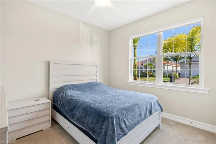 Bedroom with carpet floors and a ceiling fan