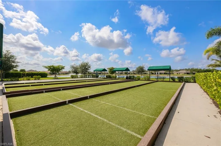 View of property's community with a game area