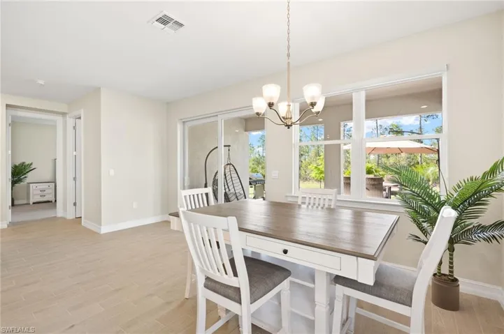 Dining room featuring a chandelier and light wood finished floors